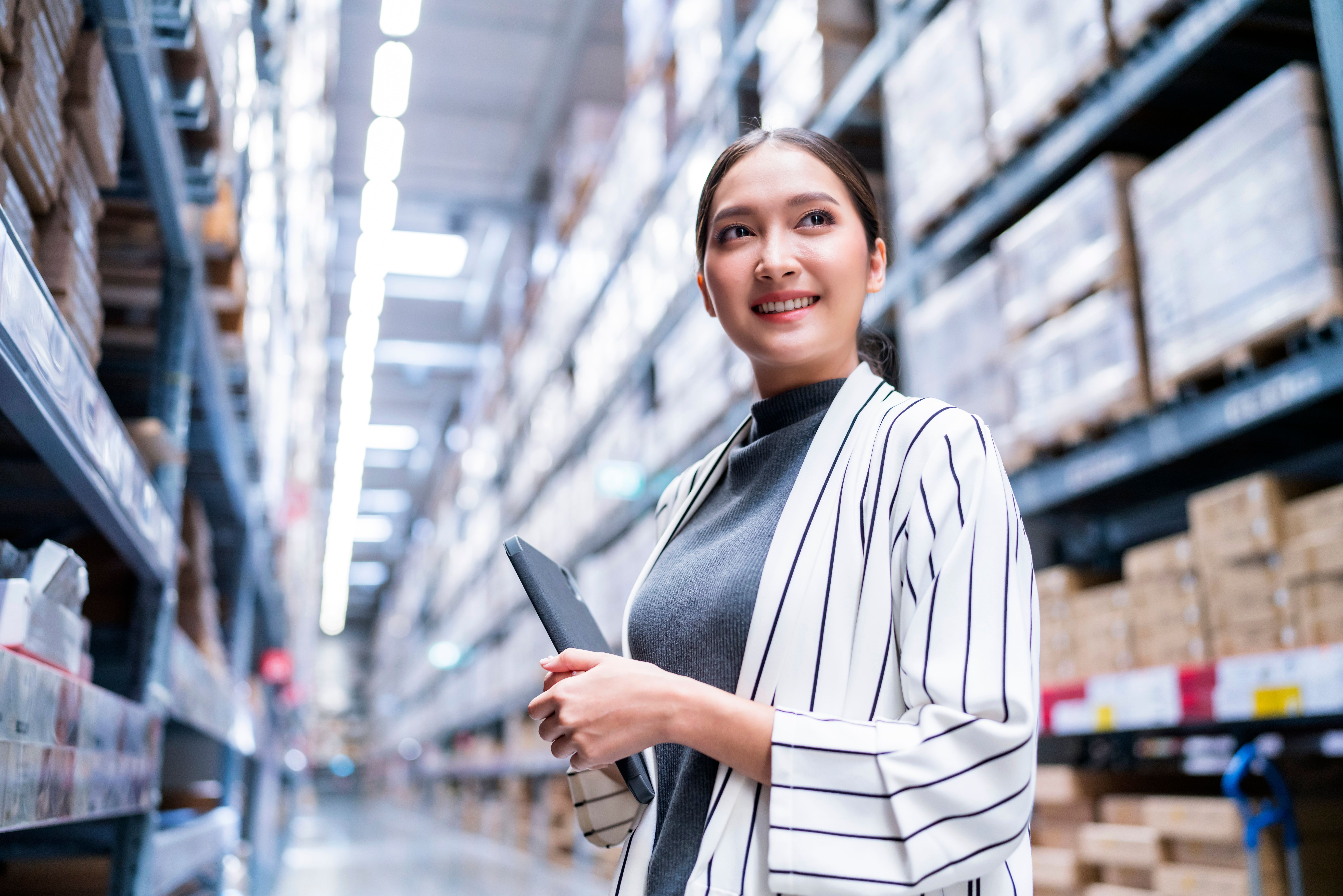portrait-asian-woman-business-owner-using-digital-tablet-checking-amount-stock-product-inventory-shelf-distribution-warehouse-factorylogistic-business-shipping-delivery-service (2).jpg
